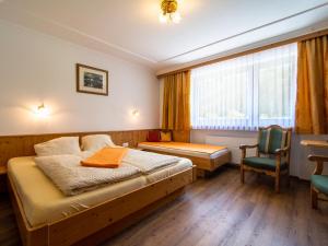 Postel nebo postele na pokoji v ubytování Ferienhaus Oblasser I