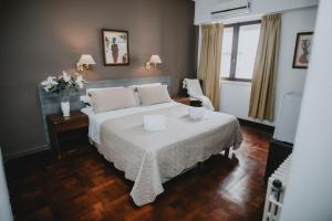 Ένα ή περισσότερα κρεβάτια σε δωμάτιο στο Gran Hotel Miglierina