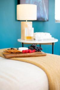 a tray of fruit on top of a bed at River View Escape close to Mount Maunganui & shops in Tauranga