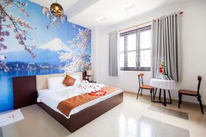 Łóżko lub łóżka w pokoju w obiekcie THÀNH VINH Hotel
