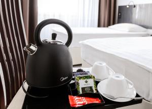 Oprema za pripravo čaja oz. kave v nastanitvi Geyzer Hotel