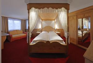 Postel nebo postele na pokoji v ubytování Hotel Ingram