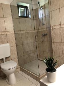 Kúpeľňa v ubytovaní Hélium Apartman + 11 fotografií