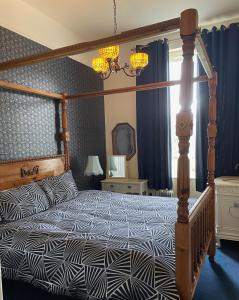 A bed or beds in a room at Inch Schoolhouse - Event Residence