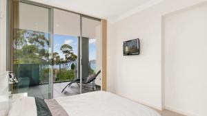 Katil atau katil-katil dalam bilik di Oceanview Haven - Ettalong Beach