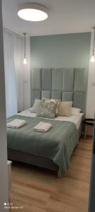 Posteľ alebo postele v izbe v ubytovaní Lux Apartament ,, Górskie Krajobrazy'' Karpacz - Mountain Landscapes