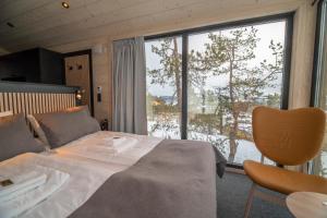 Postel nebo postele na pokoji v ubytování Lapland View Lodge