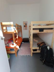 A bed or beds in a room at La Casita de Arrecife
