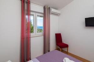 Televízia a/alebo spoločenská miestnosť v ubytovaní Seaview Apartment Marita