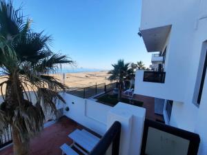 a view of the beach from the balcony of a house at SeafrontC in Swakopmund