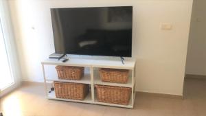 A television and/or entertainment centre at Penthouse Tarifa with Sea Views
