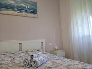 a bedroom with a bed and a painting on the wall at Sea view in Lerici