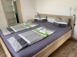 a couple of beds sitting on top of each other at Sonniges 4 **** DG-Apartment mit Aufzug+Seeblick in Ramsberg