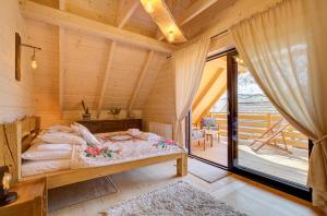 Tempat tidur dalam kamar di Beskidzka Przystań