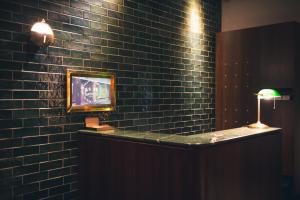 Televisyen dan/atau pusat hiburan di Getcha Hostel