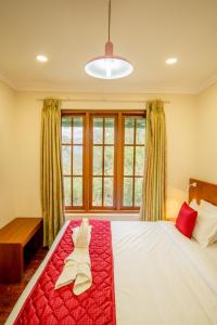 Cama ou camas em um quarto em Southern Panorama Campnoel Munnar