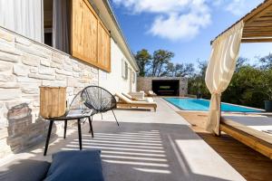 a patio with a swimming pool and a house at Villa Luna in Županje +41 photos