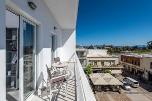 an apartment balcony with a view of a city at Milva Apartments in Kos Town