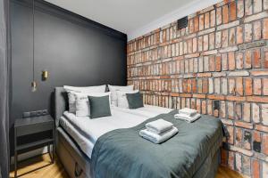 Posteľ alebo postele v izbe v ubytovaní Grobla Charming Apartment by Downtown Apartments