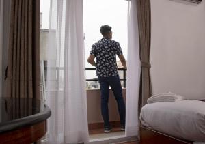 Ένα ή περισσότερα κρεβάτια σε δωμάτιο στο Hotel New Era