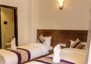 Ένα ή περισσότερα κρεβάτια σε δωμάτιο στο Hotel New Era