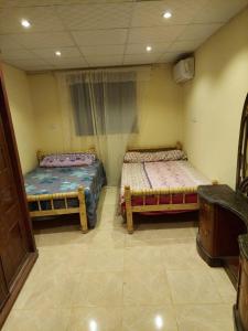 Voodi või voodid majutusasutuse Toman Pyramids hotel toas