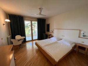 Posteľ alebo postele v izbe v ubytovaní Aparthotel Plat