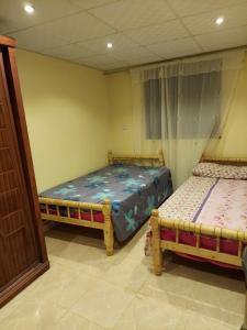 Un pat sau paturi într-o cameră la Toman Pyramids hotel