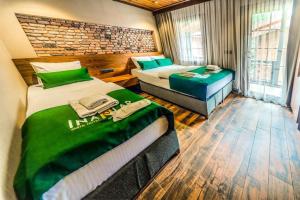 Кровать или кровати в номере Inanlar Premium Suites & Villas