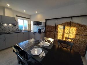 a kitchen with a table with two plates on it at Martins Apartment - Belch1952 in Lagos