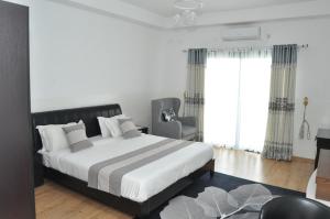 Postel nebo postele na pokoji v ubytování Hôtel Sky blue Mada