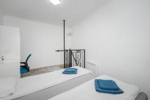 Posteľ alebo postele v izbe v ubytovaní BpR Simply Azure Apartment + 14 fotografií