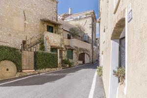 an empty street in a village with buildings at Agriturismo Da Ciletta in San Bartolomeo al Mare