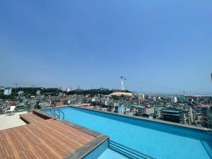 a large swimming pool on top of a building at The Light Hotel in Ha Long