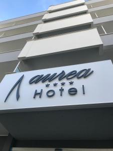 a sign on the side of a building at Aurea Hotel in Tortoreto Lido