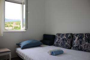 Postel nebo postele na pokoji v ubytování Apartments Bonaca Rovanjska
