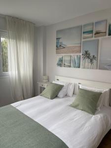 Кровать или кровати в номере Valdenoja-Sardinero Apartment Suite Beach