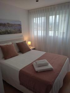 Posteľ alebo postele v izbe v ubytovaní Ría de Navia