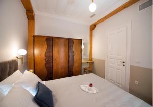 Łóżko lub łóżka w pokoju w obiekcie Avali Design Suites