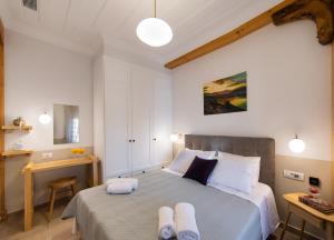 Łóżko lub łóżka w pokoju w obiekcie Avali Design Suites