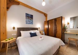 Łóżko lub łóżka w pokoju w obiekcie Avali Design Suites
