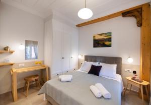 Łóżko lub łóżka w pokoju w obiekcie Avali Design Suites