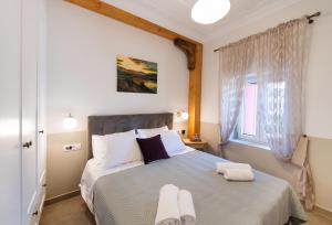 Łóżko lub łóżka w pokoju w obiekcie Avali Design Suites