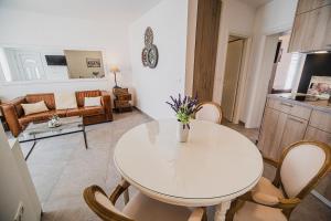 a white table and chairs in a living room at Downtown Luxury Apartments with Hot Tub in Vodice
