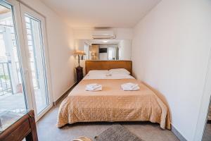 Katil atau katil-katil dalam bilik di Downtown Luxury Apartments with Hot Tub