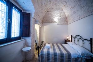 A bed or beds in a room at Charming Trulli