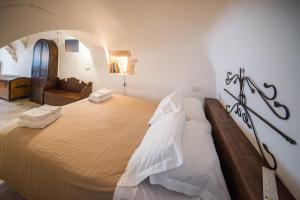 A bed or beds in a room at Charming Trulli