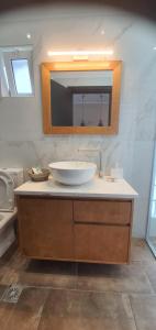 a bathroom with a sink and a mirror at Nydri Loft in Nydri +33 photos