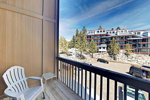 a balcony with a chair and a view of a building at Boulder Condo N in Stateline