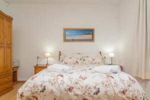 A bed or beds in a room at Villa Luna